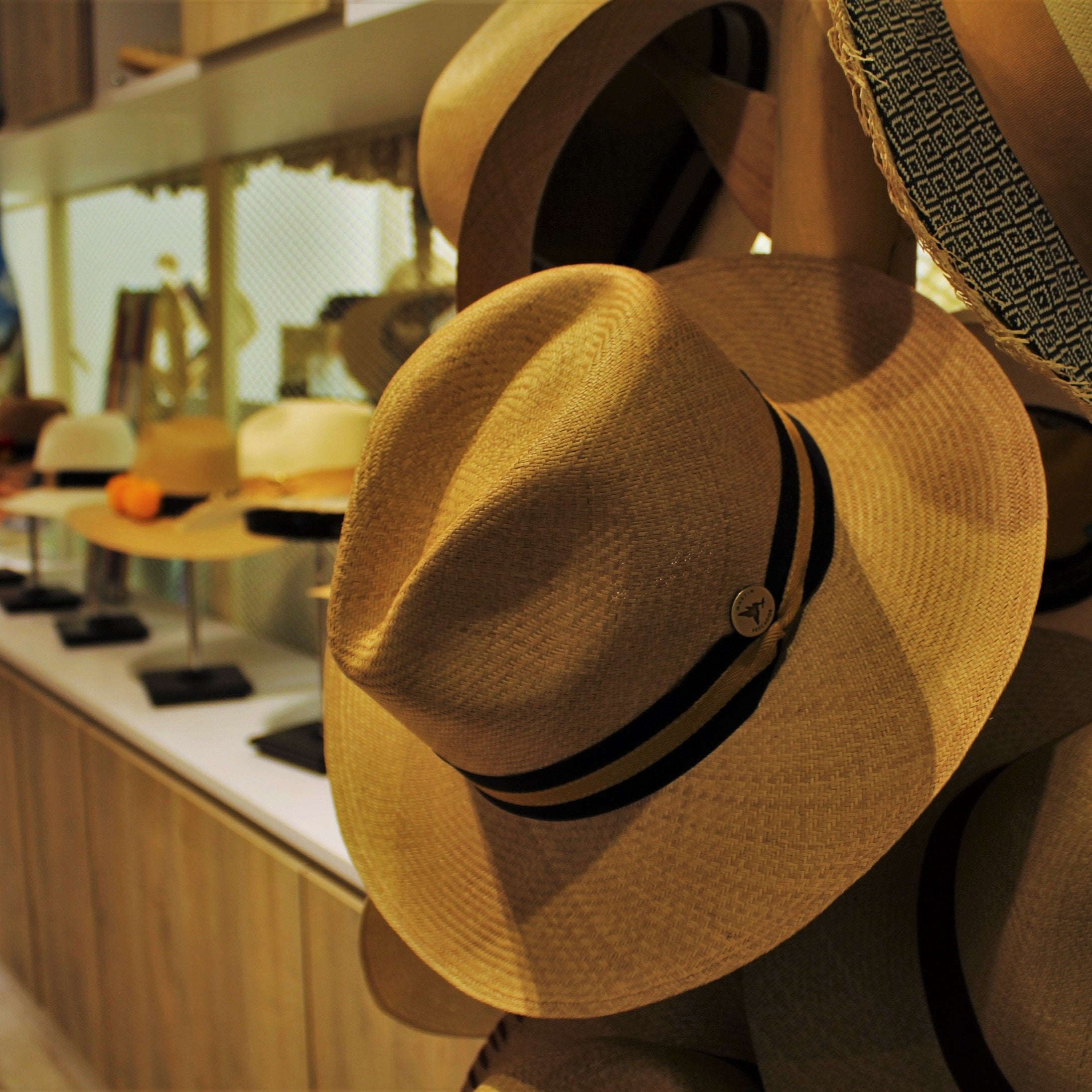 panama hats on hatstand